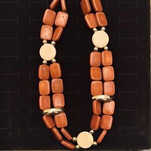 Elegant Orange and Cream Beaded Necklace with silver accents